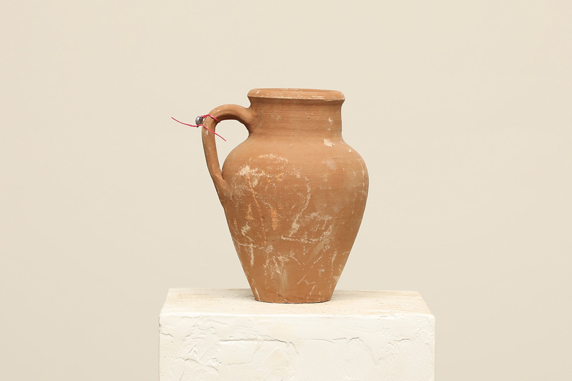 A one-of-a-kind terra cotta Turkish vintage antique vase pot with one handle, crafted from clay - Habitat Home & Garden decor