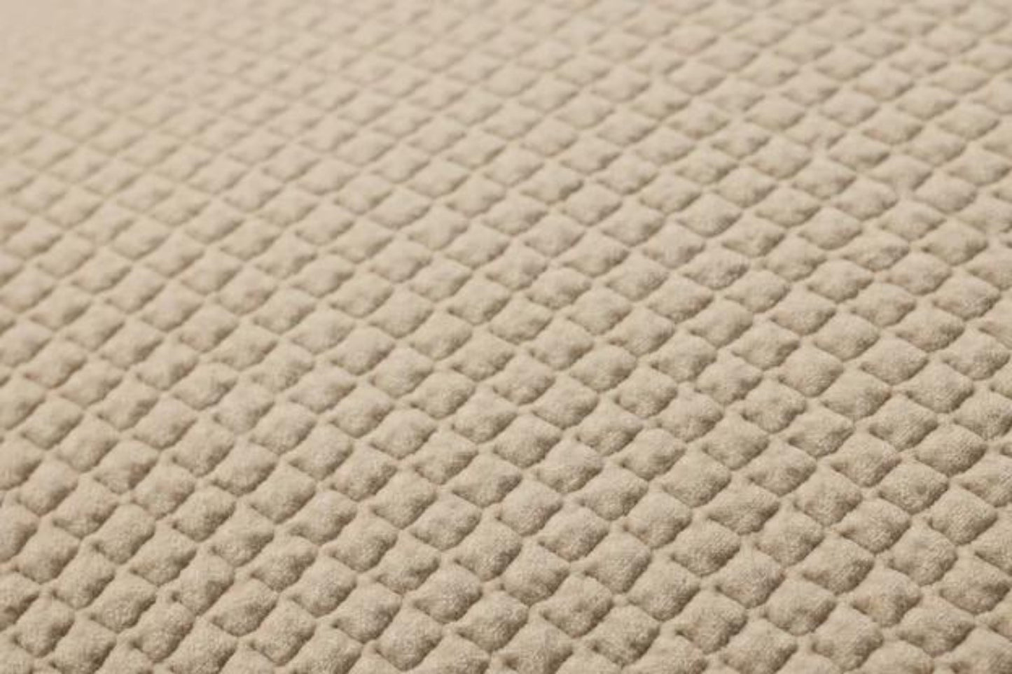 This quilted velvet throw pillow in creamy ivory and beige adds soft texture. Made of 100% cotton, it measures 22-inch square, perfect for styling in living rooms and bedrooms.