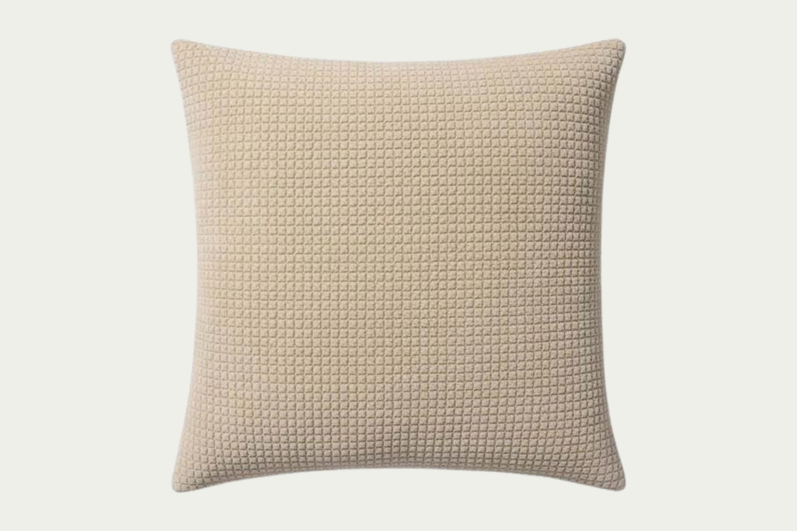 This quilted velvet throw pillow in creamy ivory and beige adds soft texture. Made of 100% cotton, it measures 22-inch square, perfect for styling in living rooms and bedrooms.