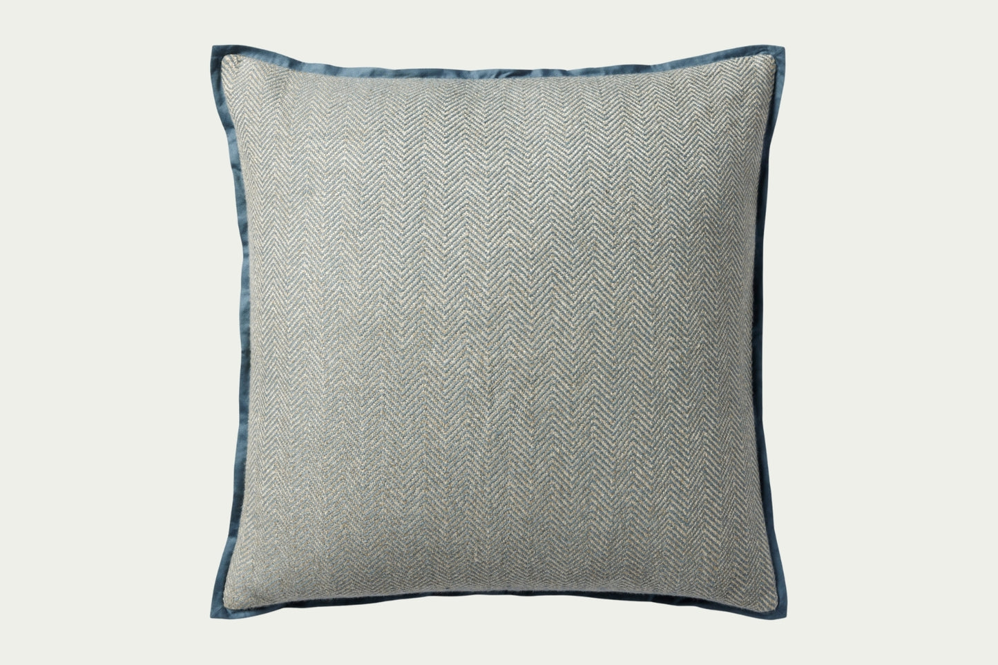 This soft blue hand-stitched herringbone modern throw pillow features a darker blue piping for a polished look.