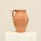 A one-of-a-kind clay brown Turkish vintage vase pot with a handle, crafted from terra cotta clay, this piece showcases timeless quality and antique craftsmanship, adding a unique touch of history to your space