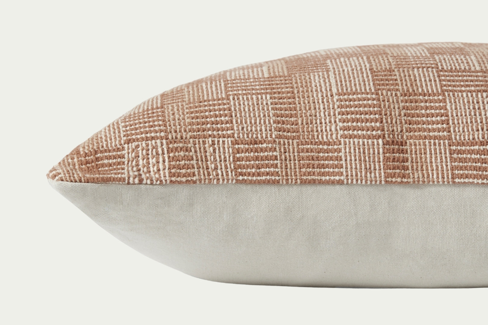 Clay rust tone and natural beige woven cotton textural modern 22-inch square throw pillow.
