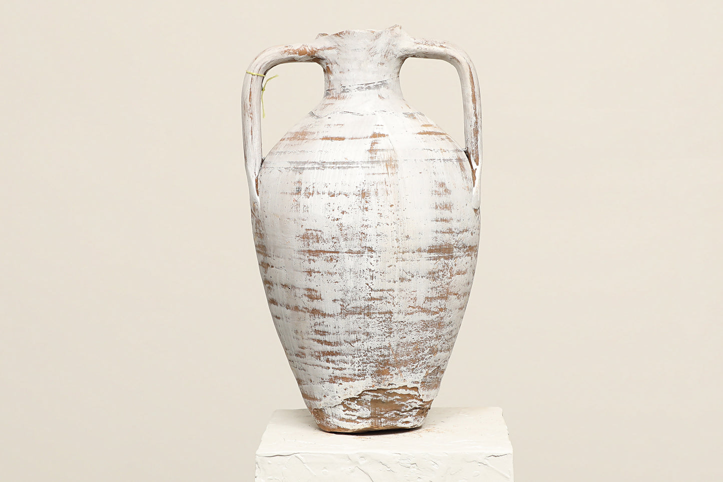 A one-of-a-kind antique white Turkish vintage piece with two handles, crafted from terra cotta clay, this piece showcases timeless quality and antique craftsmanship, adding a unique touch of history to your space