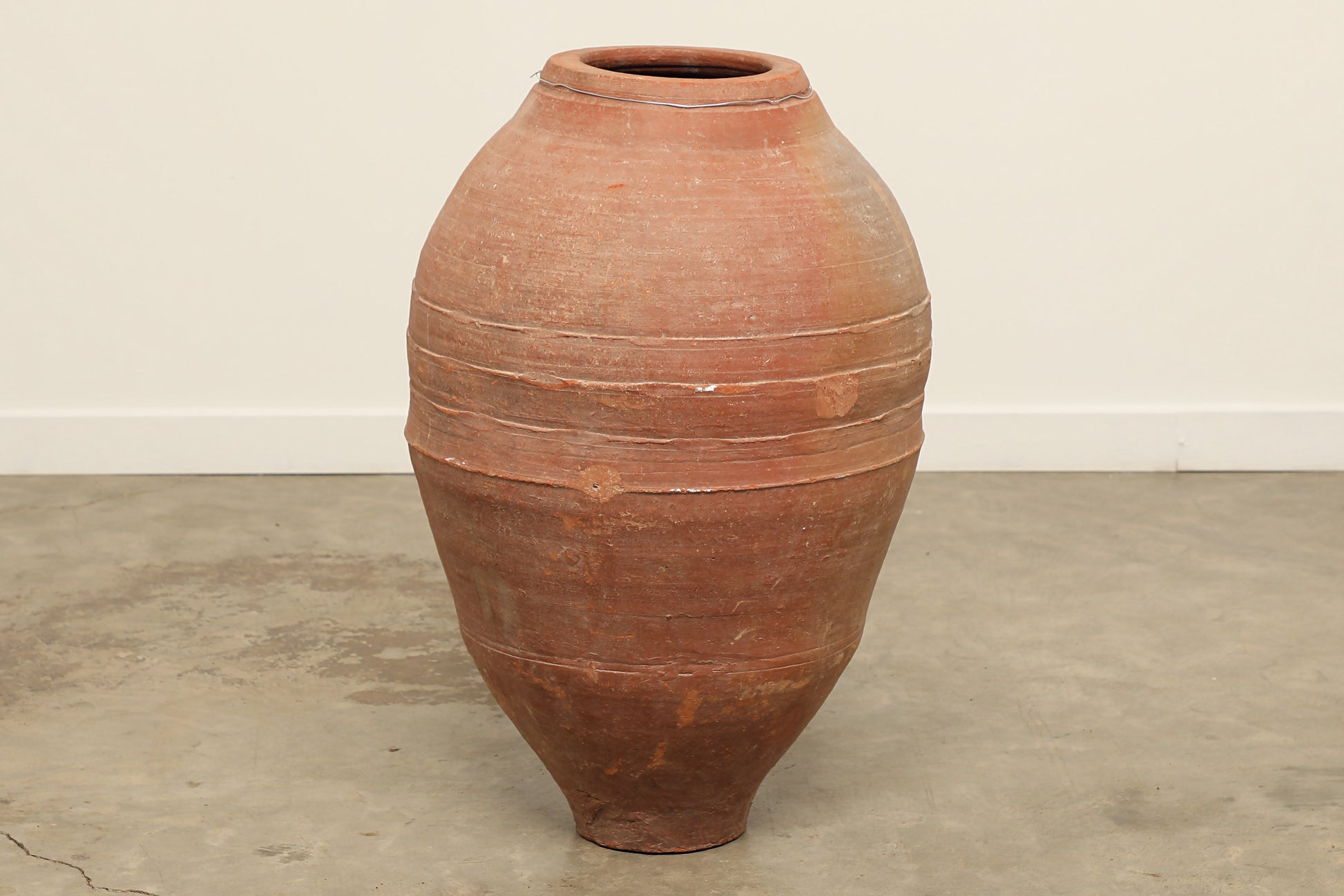 A one-of-a-kind dark brown Turkish vintage vase pot without handle, crafted from terra cotta clay, this piece showcases timeless quality and antique craftsmanship, adding a unique touch of history to your space