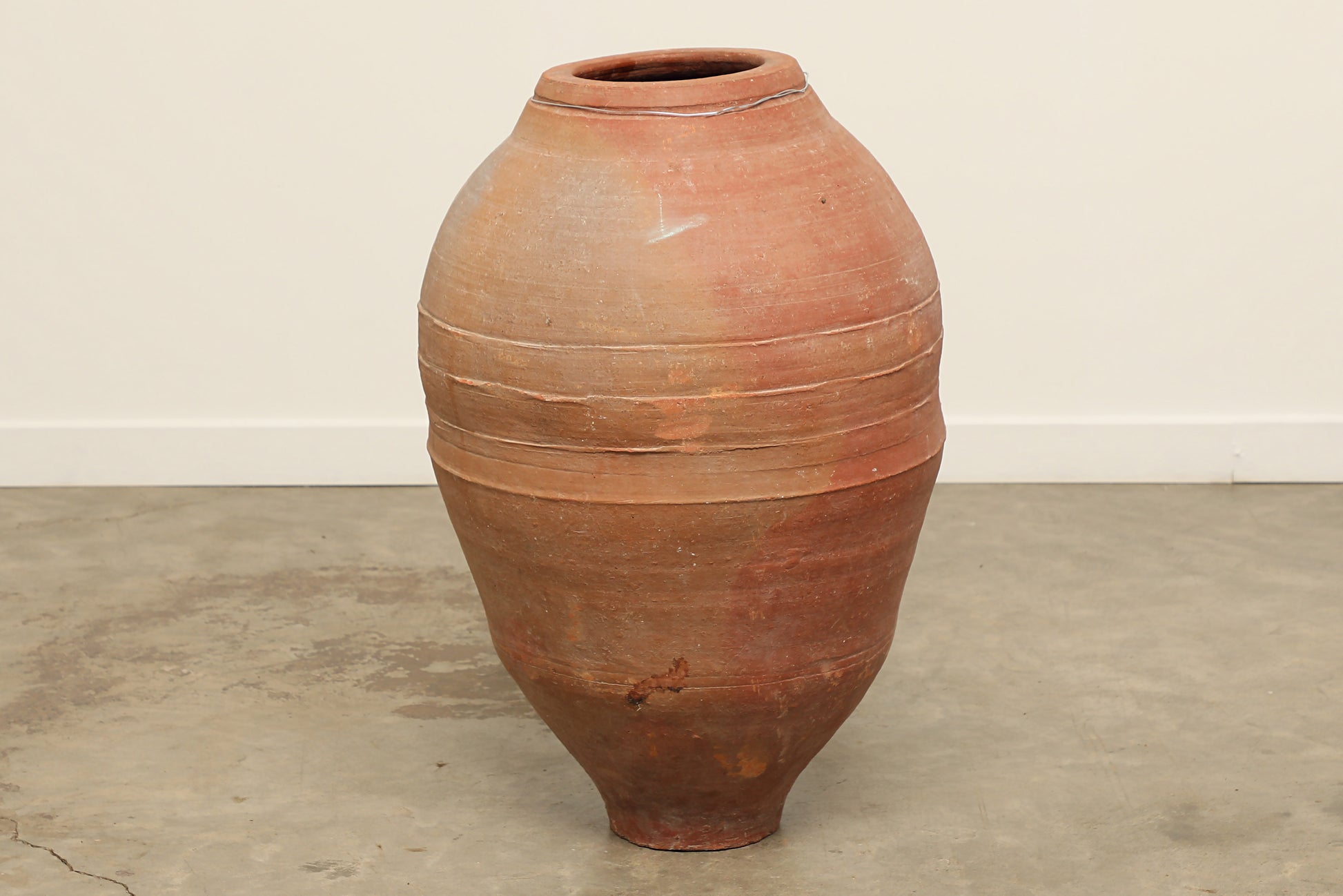 A one-of-a-kind dark brown Turkish vintage vase pot without handle, crafted from terra cotta clay, this piece showcases timeless quality and antique craftsmanship, adding a unique touch of history to your space