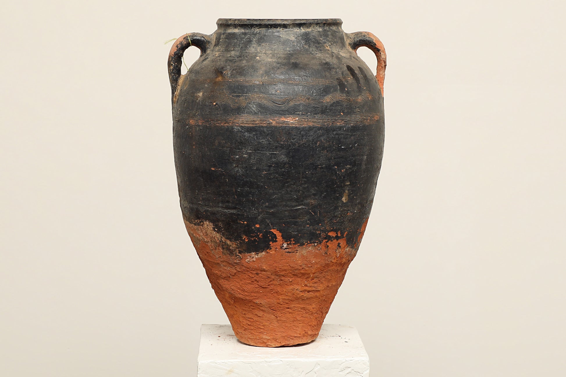 A one-of-a-kind clay brown black Turkish vintage piece with two handle, crafted from reclaimed solid wood, this piece showcases timeless quality and antique craftsmanship, adding a unique touch of history to your space