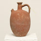 A one-of-a-kind clay brown Turkish vintage vase pot with a handle, crafted from terra cotta clay, this piece showcases timeless quality and antique craftsmanship, adding a unique touch of history to your space