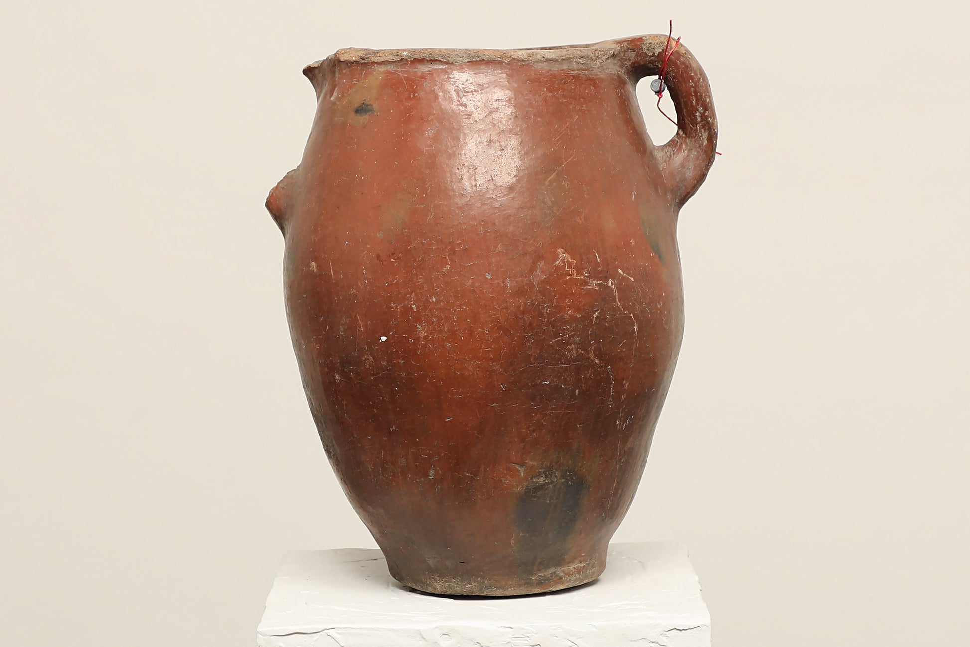 A one-of-a-kind dark brown Turkish vintage vase pot with a handle, crafted from terra cotta clay, this piece showcases timeless quality and antique craftsmanship, adding a unique touch of history to your space
