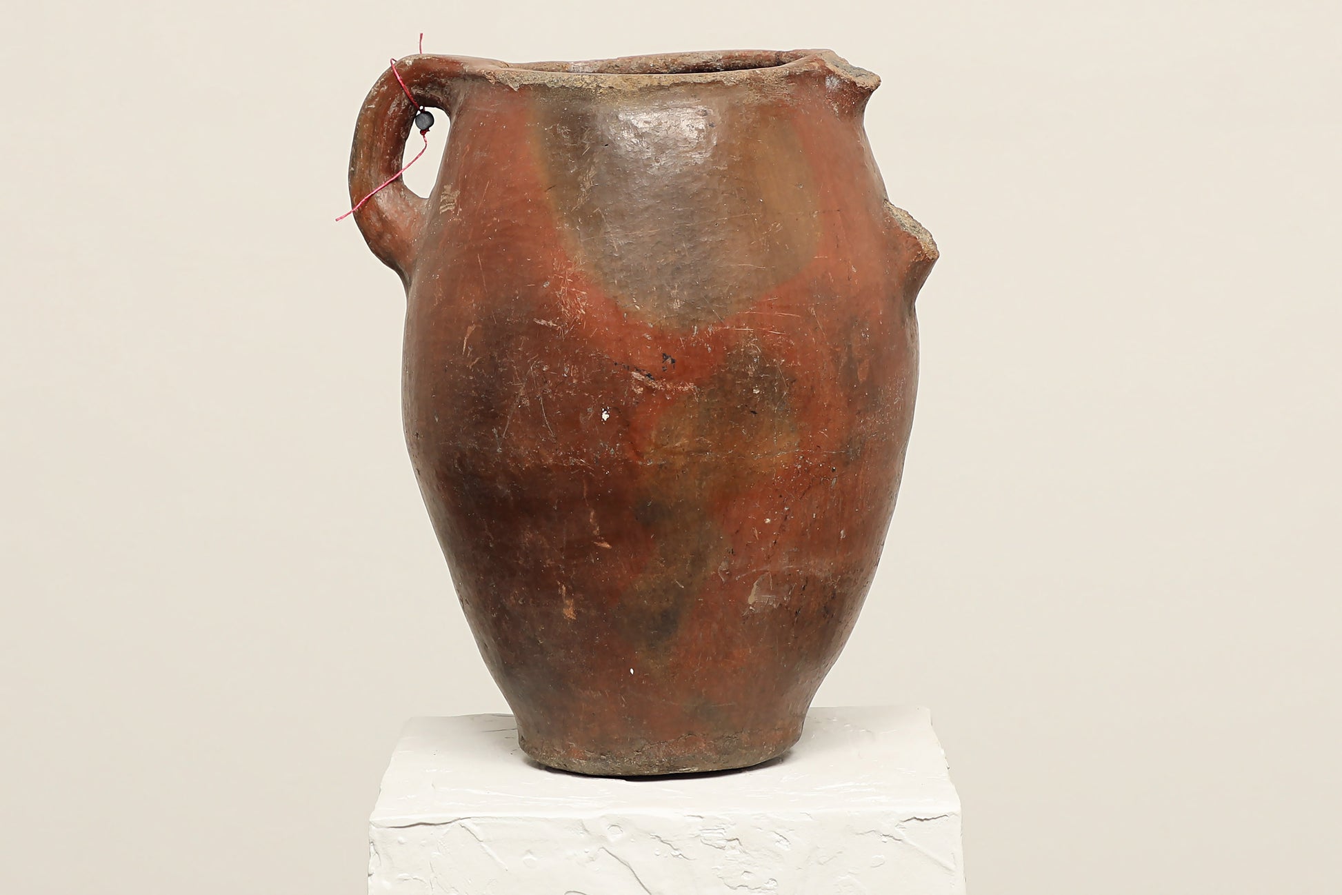 A one-of-a-kind dark brown Turkish vintage vase pot with a handle, crafted from terra cotta clay, this piece showcases timeless quality and antique craftsmanship, adding a unique touch of history to your space