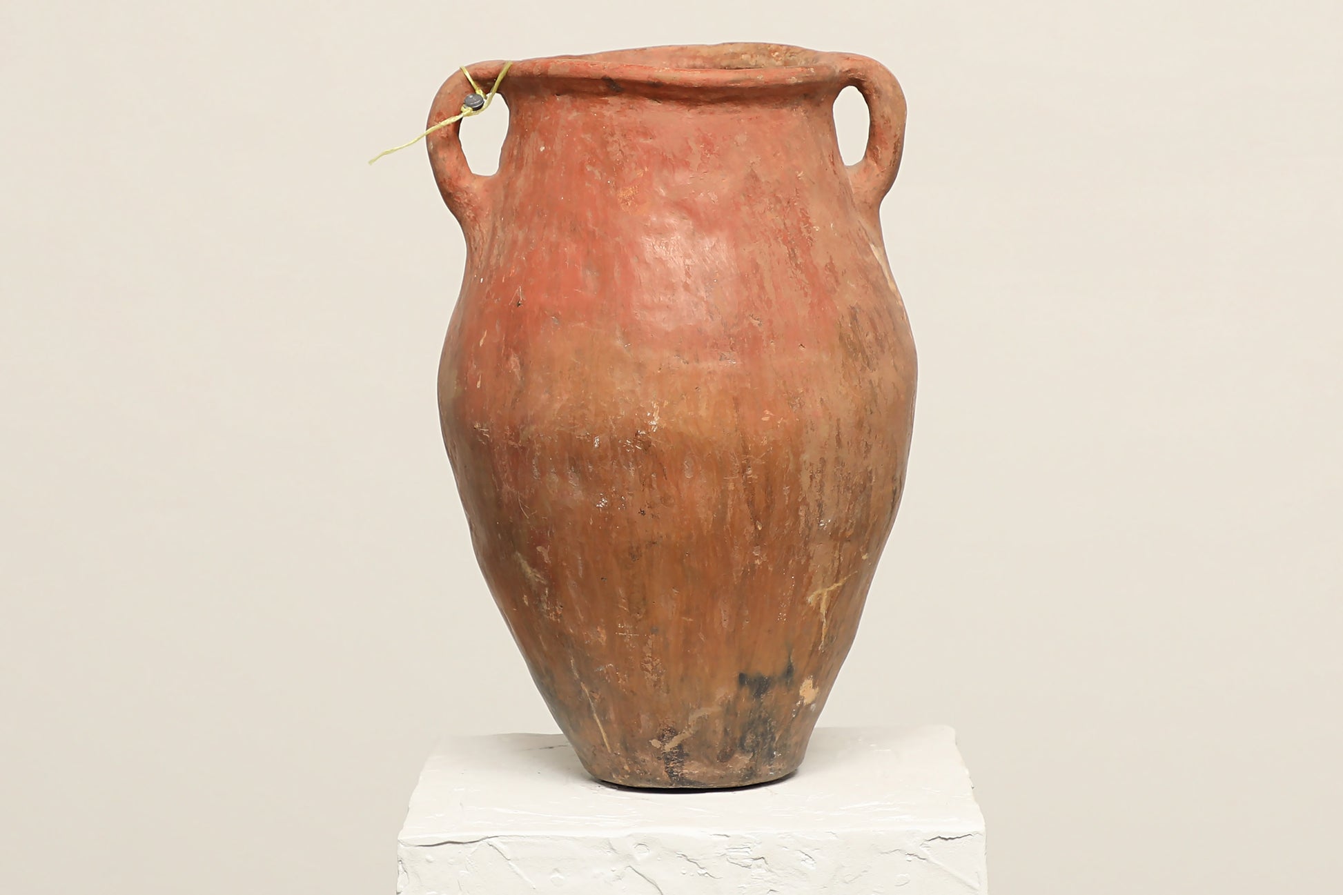 A one-of-a-kind rustic red Turkish vintage vase pot with two handles, crafted from terra cotta clay, crafted from reclaimed solid wood, this piece showcases timeless quality and antique craftsmanship, adding a unique touch of history to your space