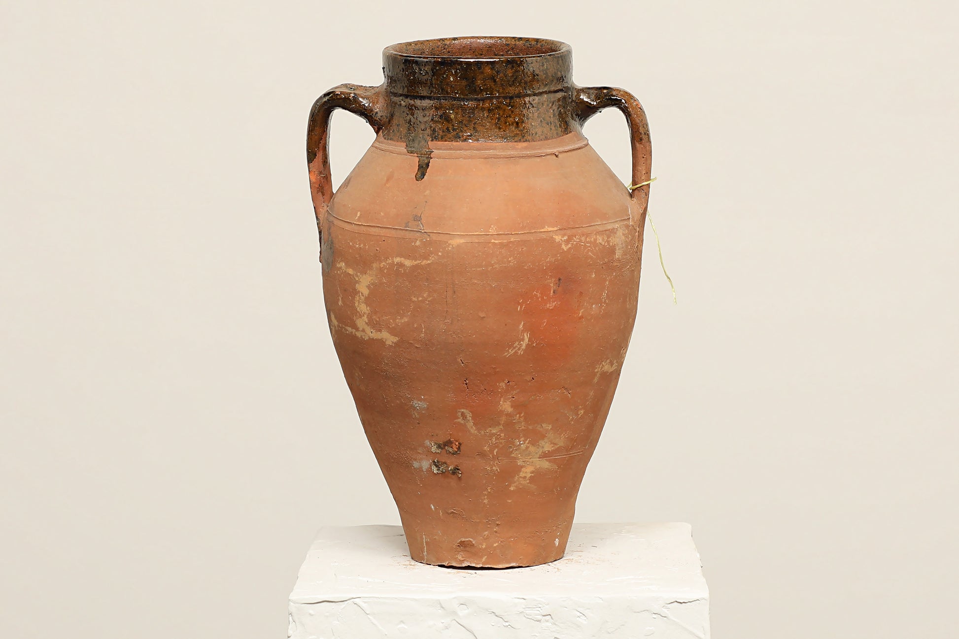 A one-of-a-kind rustic red Turkish vintage vase pot with two handles, crafted from terra cotta clay, this piece showcases timeless quality and antique craftsmanship, adding a unique touch of history to your space