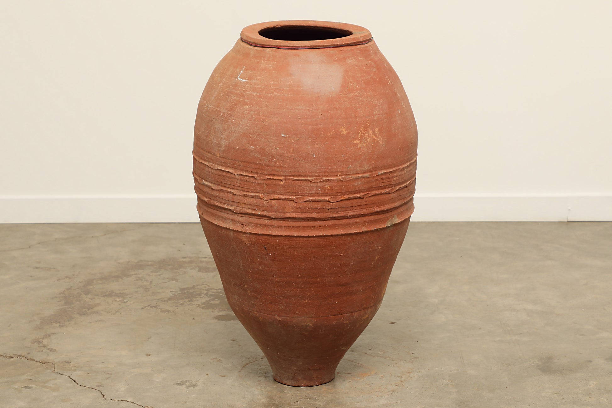 A one-of-a-kind rustic red Turkish vintage vase pot without a handle, crafted from terra cotta clay, this piece showcases timeless quality and antique craftsmanship, adding a unique touch of history to your space