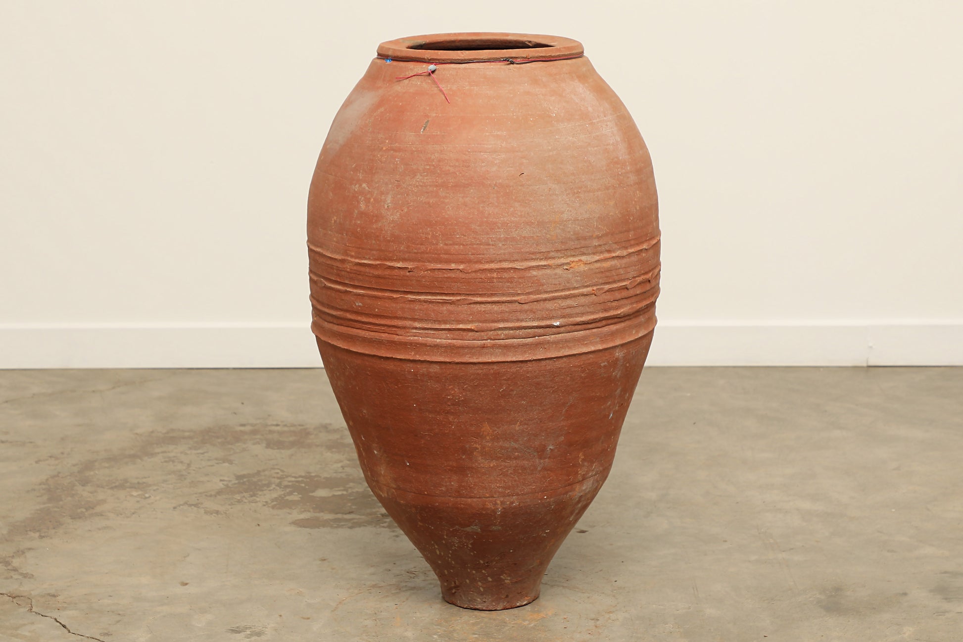 A one-of-a-kind rustic red Turkish vintage vase pot without a handle, crafted from terra cotta clay, this piece showcases timeless quality and antique craftsmanship, adding a unique touch of history to your space