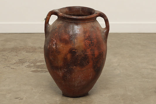 A one-of-a-kind dark brown Turkish vintage vase pot with two handles, crafted from terra cotta clay, this piece showcases timeless quality and antique craftsmanship, adding a unique touch of history to your space