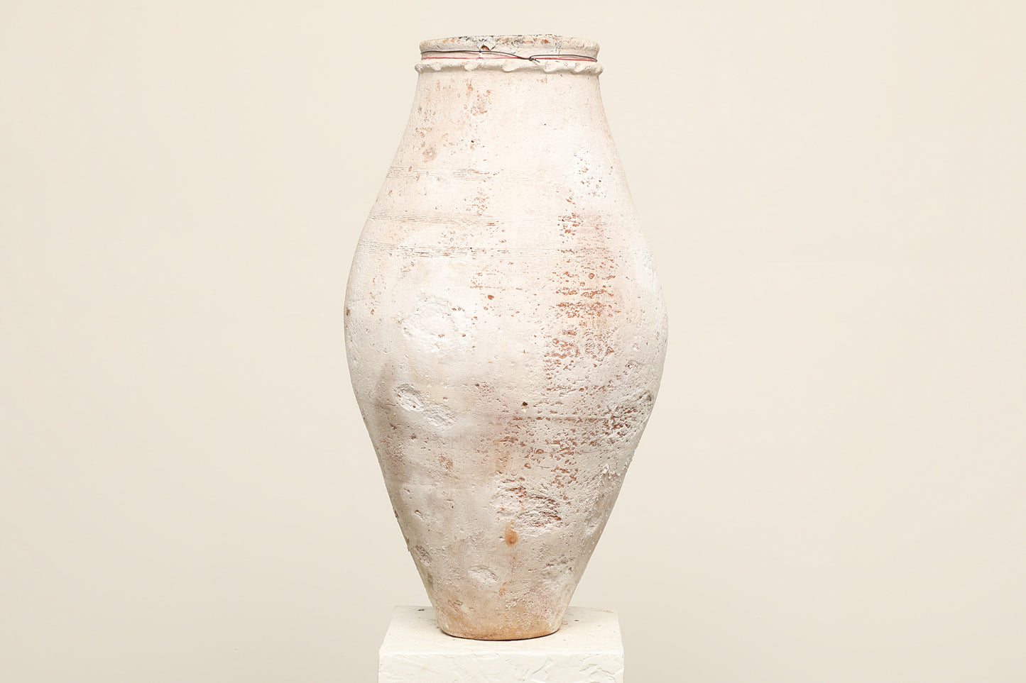 A one-of-a-kind white Turkish vintage vase pot without handle, crafted from terra cotta clay, this piece showcases timeless quality and antique craftsmanship, adding a unique touch of history to your space