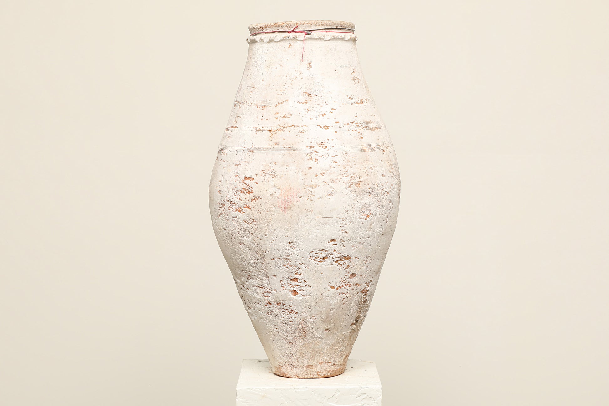 A one-of-a-kind white Turkish vintage vase pot without handle, crafted from terra cotta clay, this piece showcases timeless quality and antique craftsmanship, adding a unique touch of history to your space