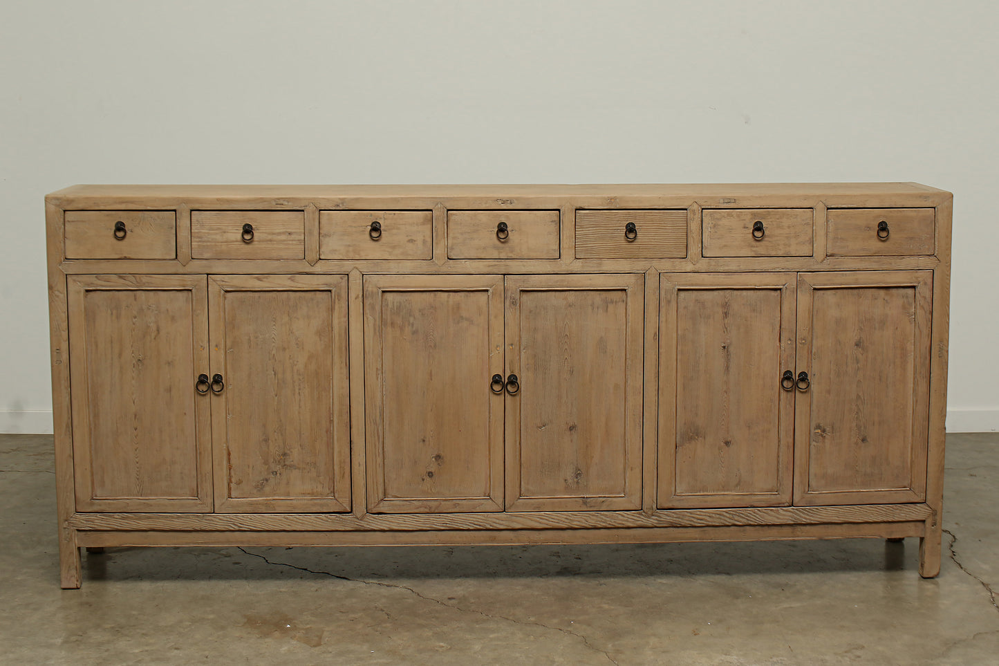 A one-of-a-kind, vintage rustic brown sideboard 3 cabinets with 7 drawers handcrafted of elm natural wood in a farmhouse style, 94 inches long is narrow at 16 inches.