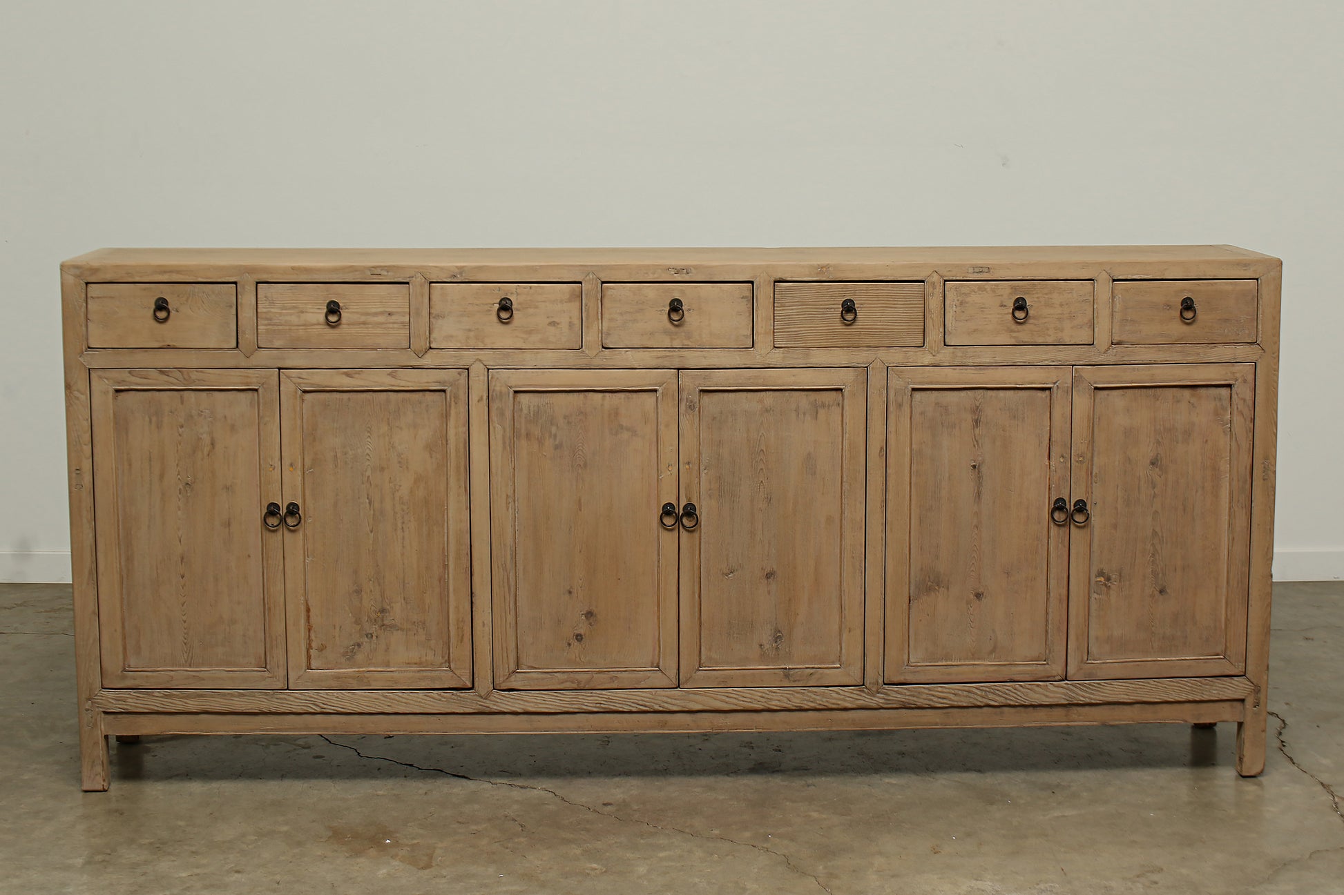 A one-of-a-kind, vintage rustic brown sideboard 3 cabinets with 7 drawers handcrafted of elm natural wood in a farmhouse style, 94 inches long is narrow at 16 inches.