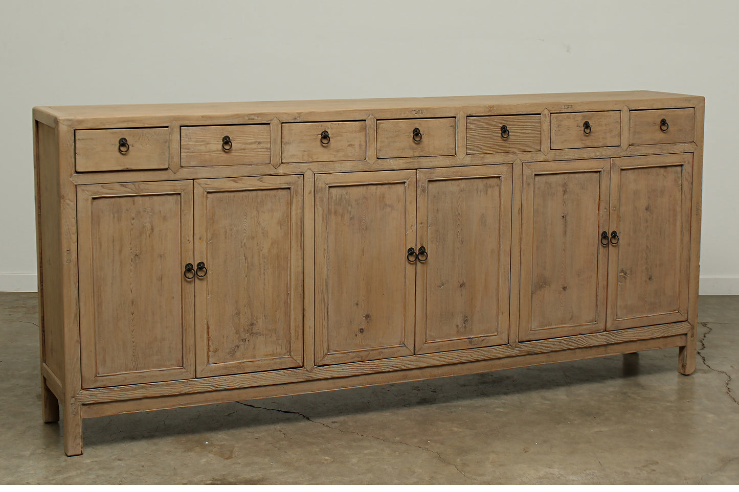 A one-of-a-kind, vintage rustic brown sideboard 3 cabinets with 7 drawers handcrafted of elm natural wood in a farmhouse style, 94 inches long is narrow at 16 inches.