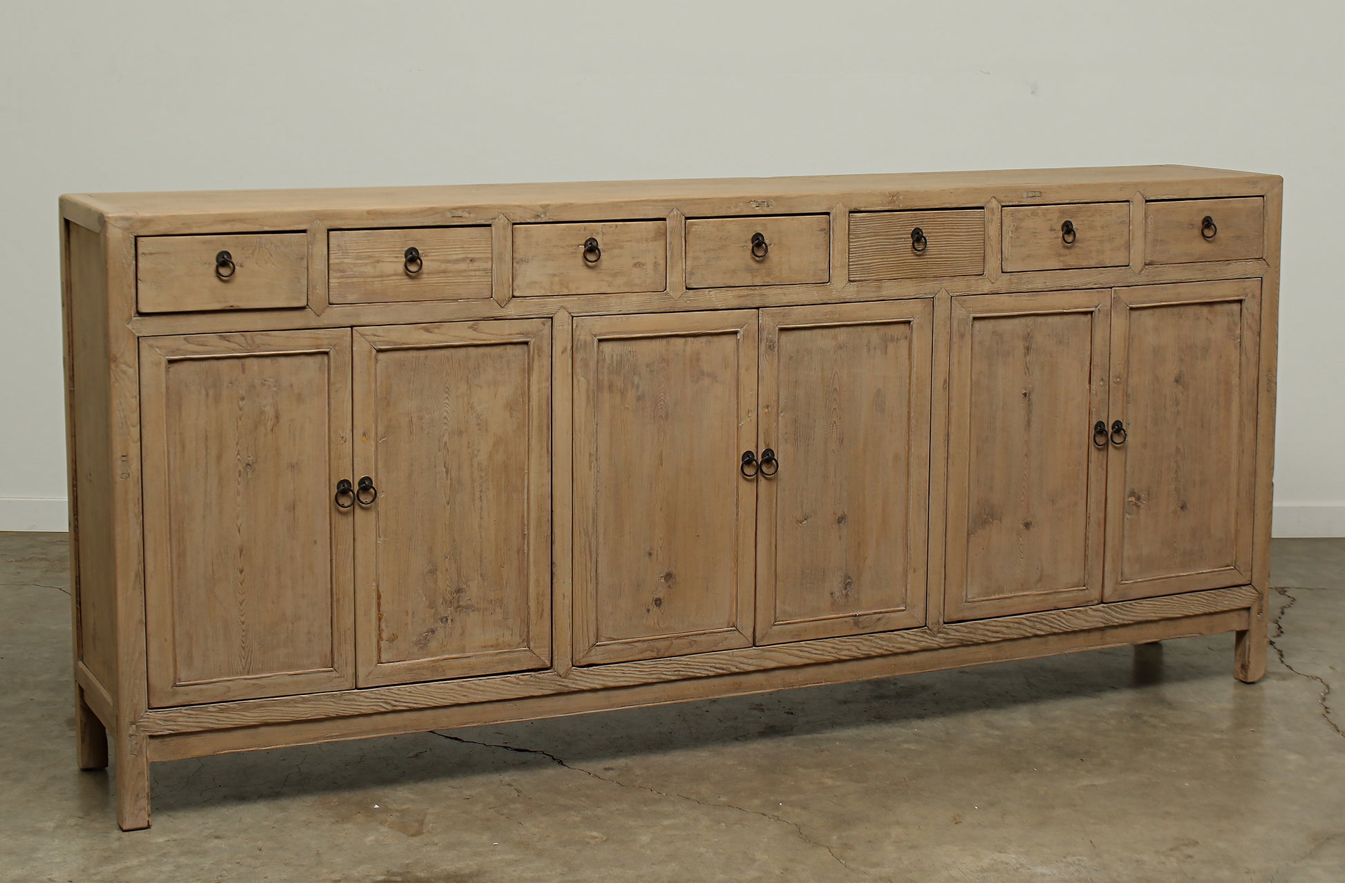 A one-of-a-kind, vintage rustic brown sideboard 3 cabinets with 7 drawers handcrafted of elm natural wood in a farmhouse style, 94 inches long is narrow at 16 inches.