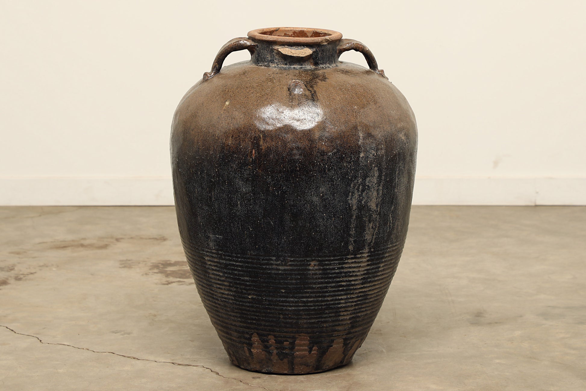 black and brown glazed terracotta vintage antique vase pot with four handles