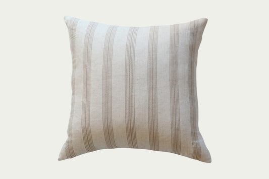 The Lawson Stripe Pillow is ideal for adding neutral texture and dimension to a space. Handwoven, this accent pillow features brown woven stripes on a cream cotton background and a 100% heavy-weight linen back.