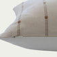 Brown woven stripes on a cream cotton background and a 100% off-white linen back in a 20-inch by 30-inch rectangle.