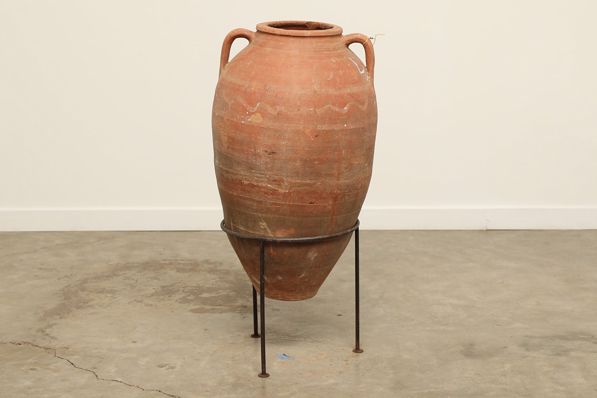 A one-of-a-kind dark brown Turkish vintage vase pot with two handles, crafted from terra cotta clay, this piece showcases timeless quality and antique craftsmanship, adding a unique touch of history to your space