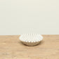 Natural white fluted marble bowl with a ruffle edge - timeless modern home decor.