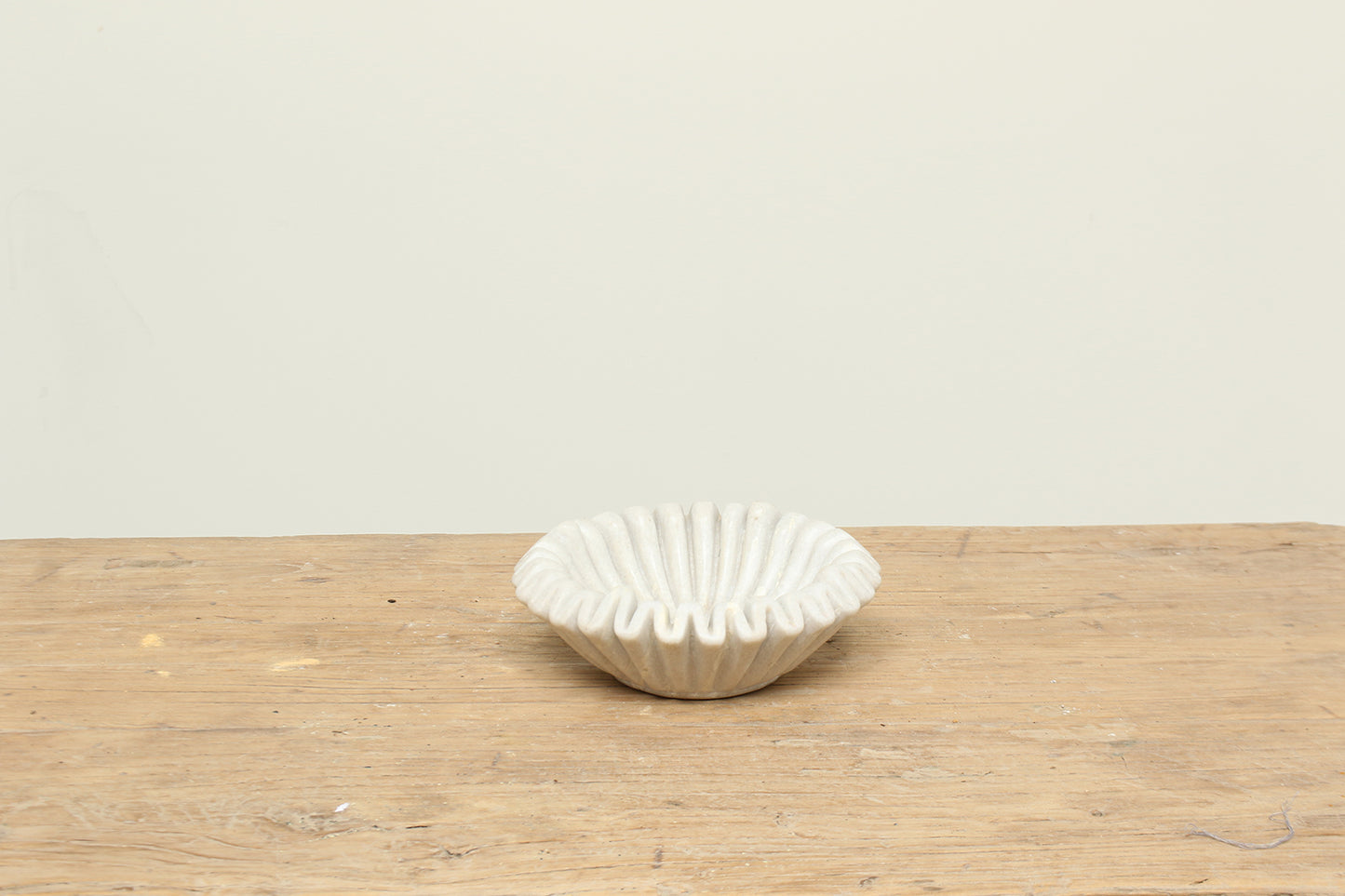 Natural white fluted marble bowl with a ruffle edge - timeless modern home decor.