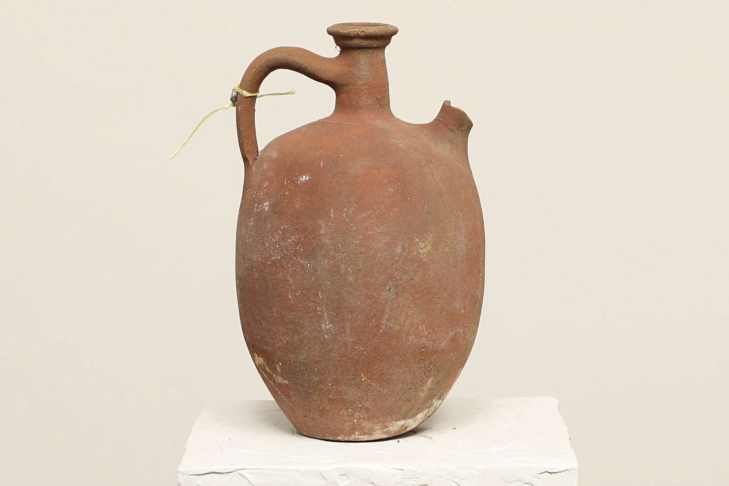 A one-of-a-kind clay brown Turkish vintage piece with a handle, crafted from terra cotta clay, this piece showcases timeless quality and antique craftsmanship, adding a unique touch of history to your space