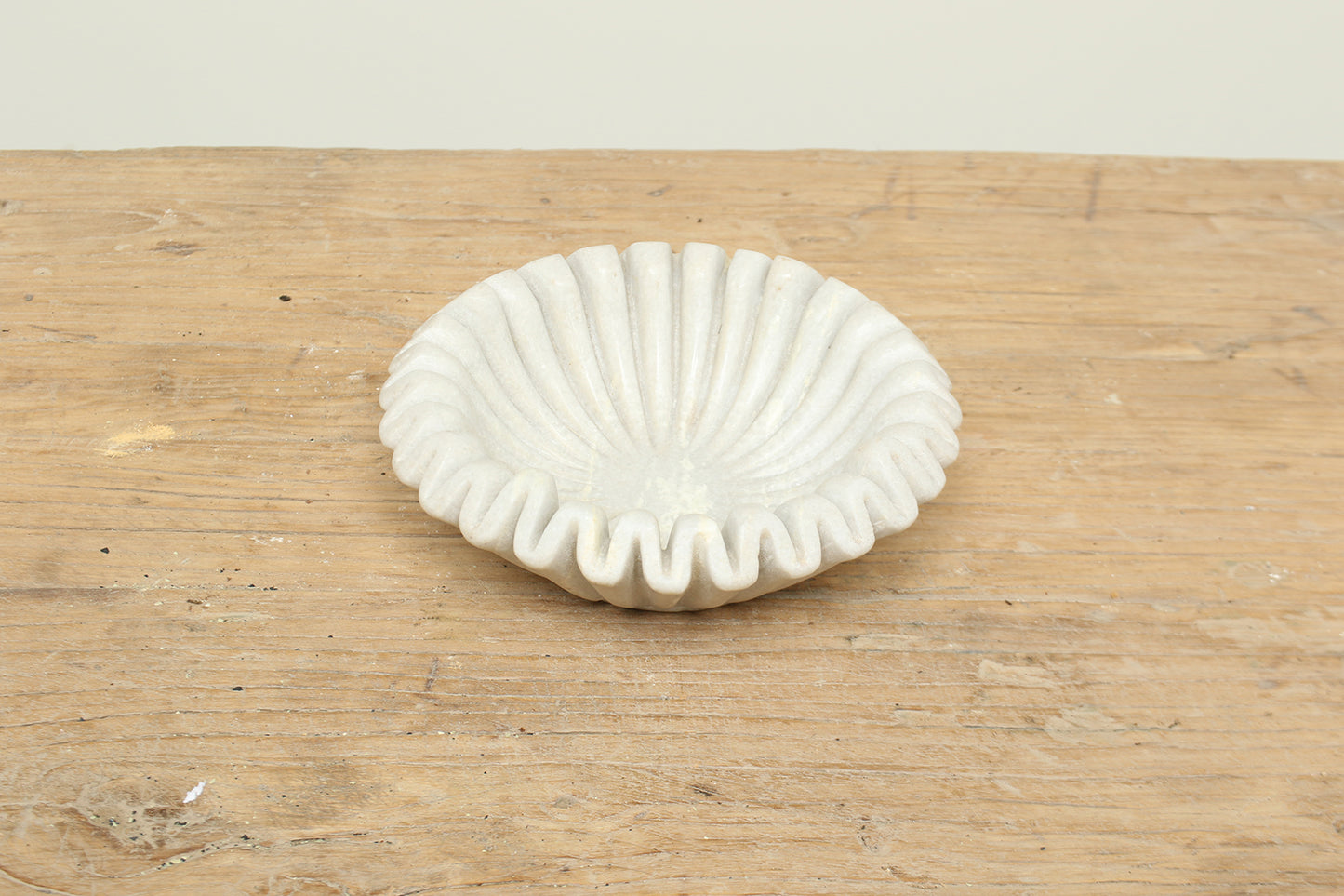 Natural white fluted marble bowl with a ruffle edge - timeless modern home decor.