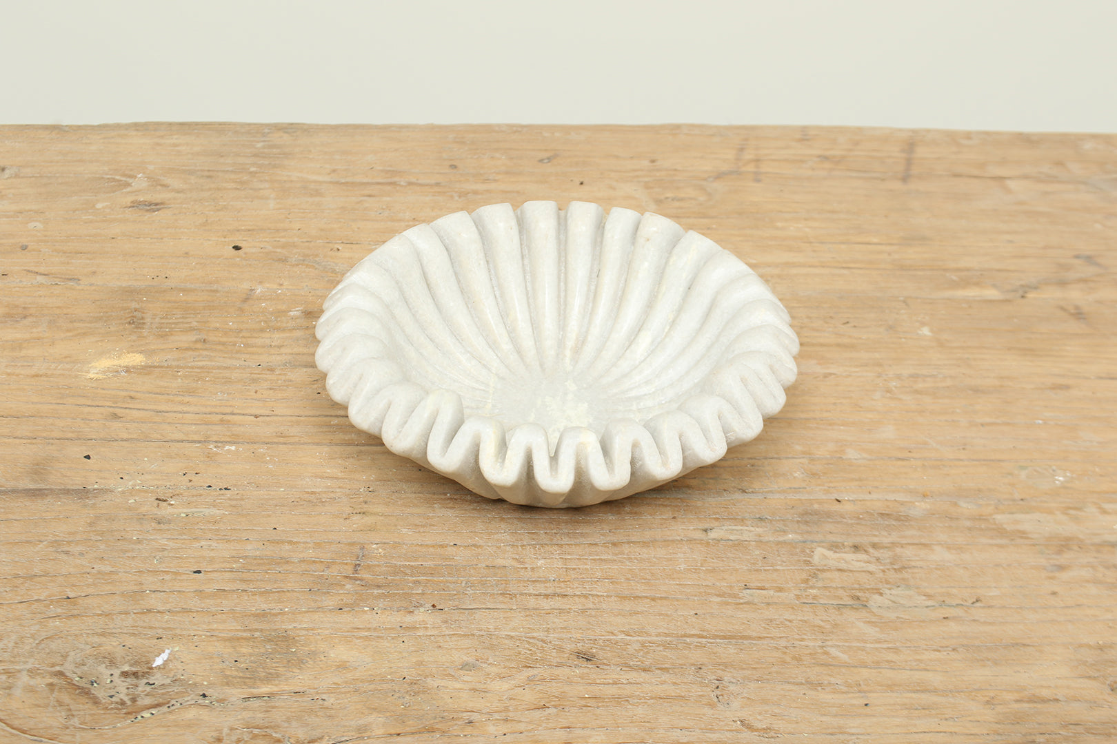 Natural white fluted marble bowl with a ruffle edge - timeless modern home decor.