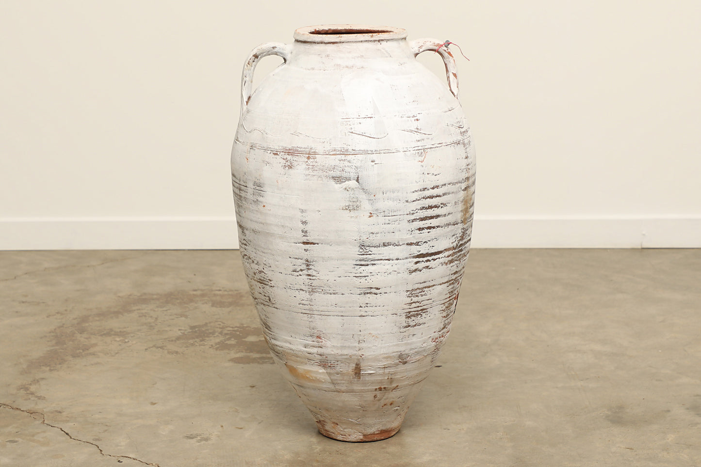 A one-of-a-kind white Turkish vintage vase pot with two handles, crafted from terra cotta clay, this piece showcases timeless quality and antique craftsmanship, adding a unique touch of history to your space