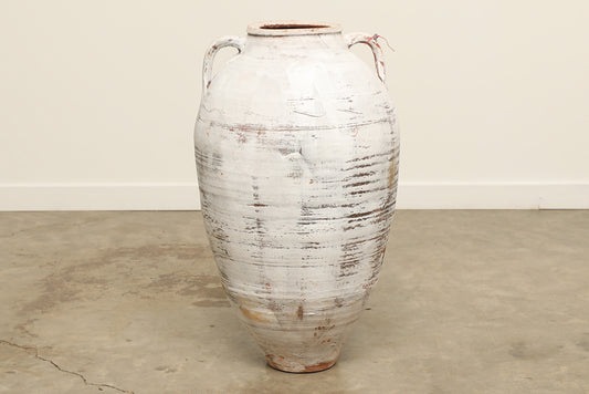 A one-of-a-kind white Turkish vintage vase pot with two handles, crafted from terra cotta clay, this piece showcases timeless quality and antique craftsmanship, adding a unique touch of history to your space