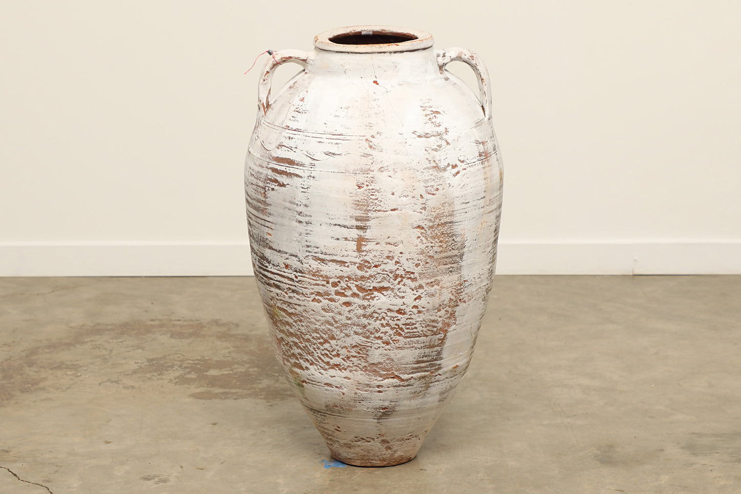 A one-of-a-kind white Turkish vintage vase pot with two handles, crafted from terra cotta clay, this piece showcases timeless quality and antique craftsmanship, adding a unique touch of history to your space